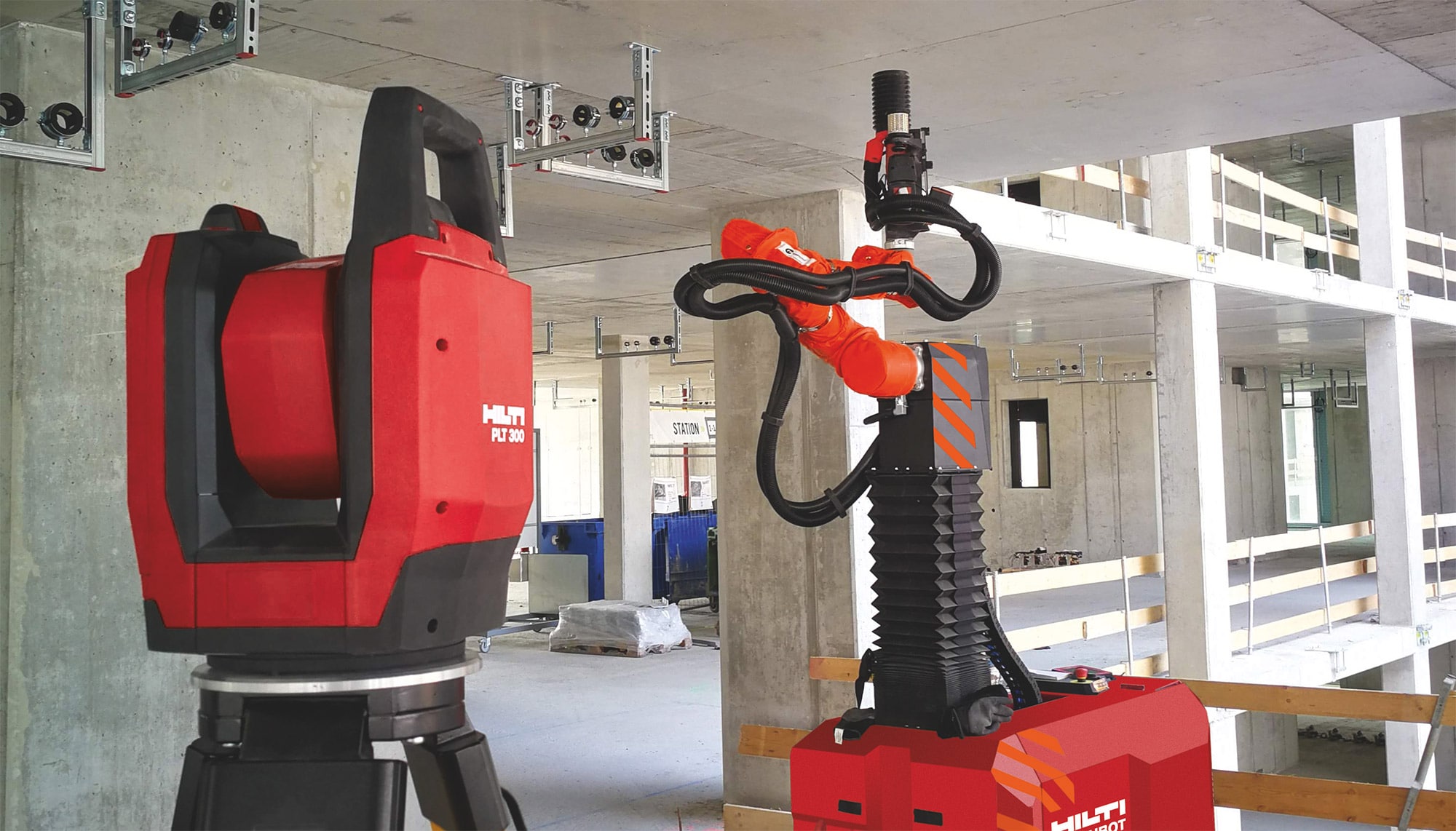 Hilti PLT 300-totaalstation en boorrobot Jaibot op een werf tijdens een MEP-installatie