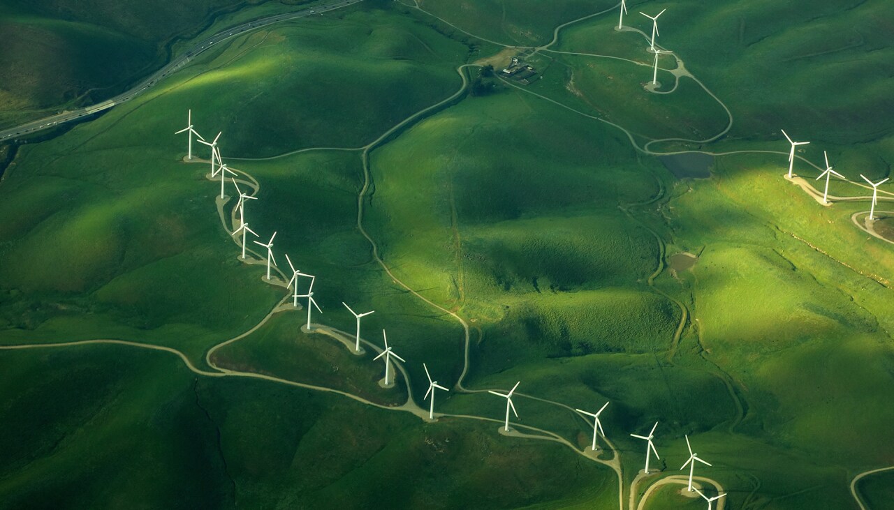 1018298440 beautiful green aerial view of windmill farm providing eco-friendly energy sustainabilityÂ